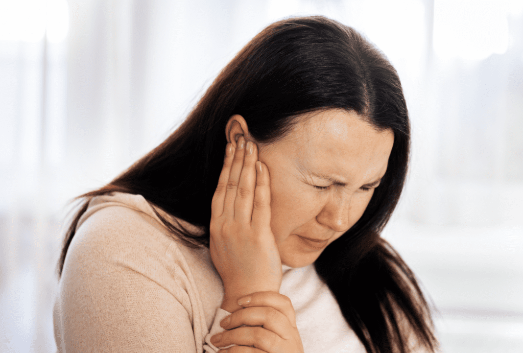 a woman who used tepezza suffering from tinnitus