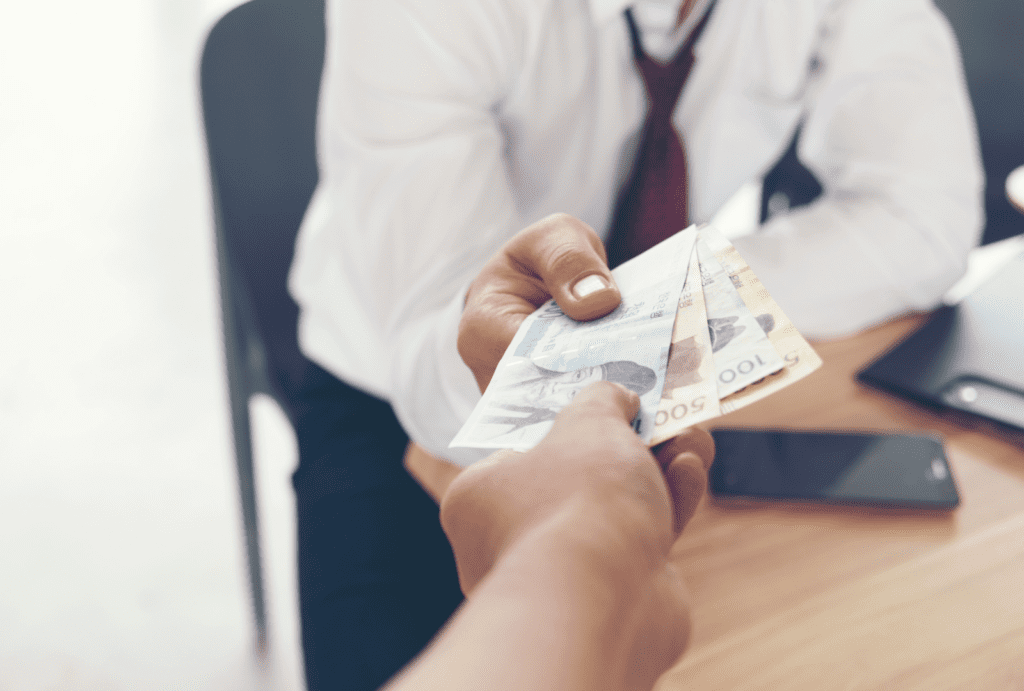 a man giving cash